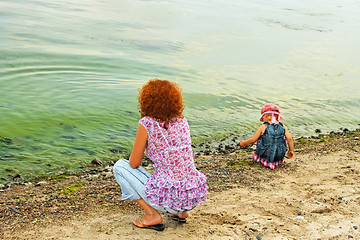 Image showing Mother and daughter on the bank