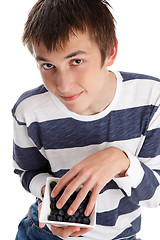 Image showing Blueberries superfood - boy eating blueberries