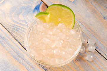 Image showing tapioca pearls with lime. white bubble tea ingredients