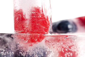 Image showing Raspberry and blackberry frozen in ice sticks