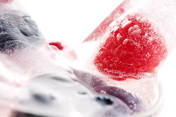 Image showing Raspberry and blackberry frozen in ice sticks