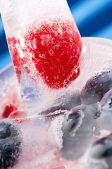 Image showing Raspberry and blackberry frozen in ice sticks