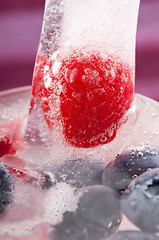 Image showing Raspberry and blackberry frozen in ice sticks