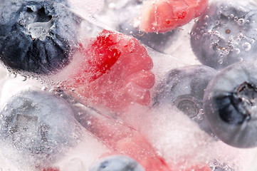 Image showing Raspberry and blackberry frozen in ice sticks