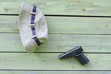 Image showing Hat and Pistol on the Wall