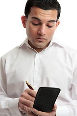 Image showing Man or waiter writing notes