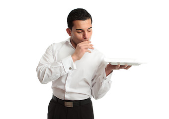 Image showing Delighted waiter holding plate