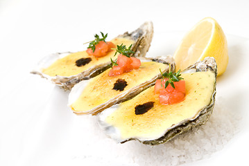 Image showing oysters with sauce and lemon