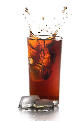 Image showing Beautiful splash of cola in glass isolated on white