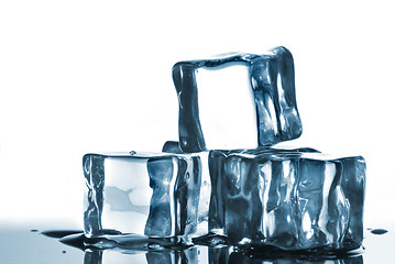 Image showing ice cubes with water drops on white