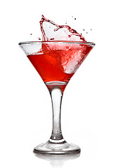 Image showing Red cocktail with splash isolated on white