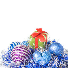 Image showing christmas balls with and gift with decoration isolated on white