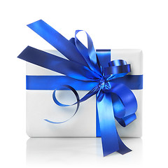 Image showing Holiday gift with blue ribbon isolated on white