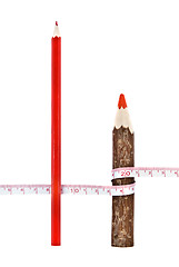 Image showing Red thick and thin pencils with ruler isloated on white