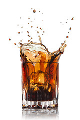 Image showing splash of cola in glass isolated on white