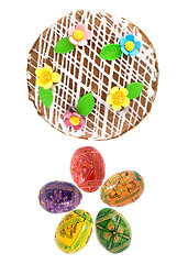 Image showing top view of easter eggs and cake isolated on white