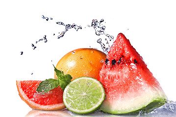 Image showing Water splash on fresh fruits isolated on white