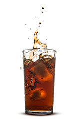 Image showing Beautiful splash of cola in glass isolated on white