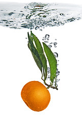 Image showing Splash of orange to water with bubbles of air