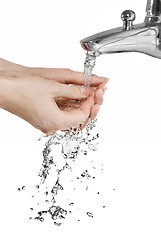 Image showing hands with pouring water isolated on white