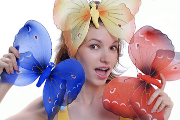 Image showing girl with color butterflies isolated on a white background