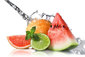Image showing Water splash on fresh fruits isolated on white