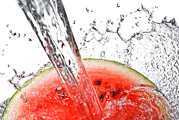 Image showing watermelon and water splash isolated on white
