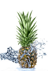 Image showing pineapple with water splash isolated on white