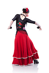 Image showing young woman dancing flamenco with castanets isolated on white