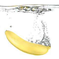 Image showing banana dropped into water isolated on white