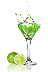 Image showing Green alchohol cocktail with splash and green lime isolated on w