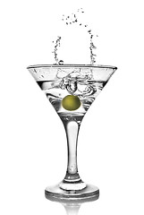 Image showing martini with olive and splash isolated on white