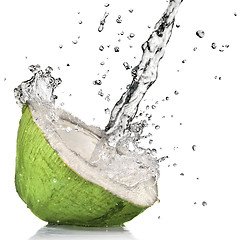 Image showing Green coconut with water splash isolated on white