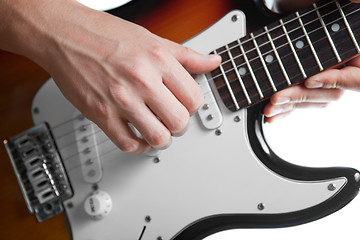 Image showing playing on electric guitar