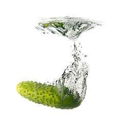 Image showing green cucumber dropped into water isolated on white