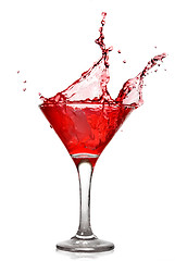 Image showing Red cocktail with splash isolated on white