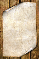 Image showing old paper isolated on wood