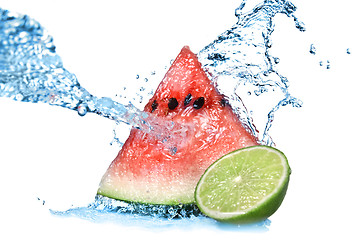 Image showing watermelon with lime and water splash isolated on white