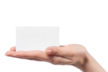 Image showing Woman hand holding empty visiting card and pointing on it isolat