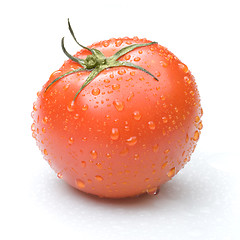 Image showing red tomato with water drops isolated on white