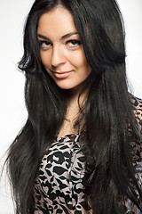 Image showing Portrait of attractive young smiling woman on white