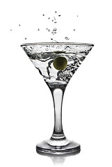 Image showing martini with olive and splash isolated on white