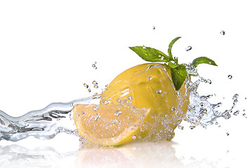 Image showing Water splash on grapefruit with mint isolated on white