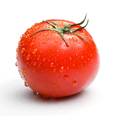 Image showing red tomato with water drops isolated on white