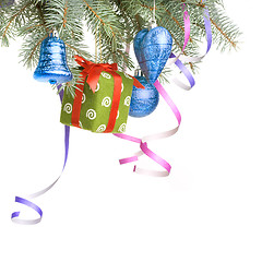 Image showing Christmas balls, gift and decoration on fir tree branch isolated