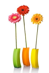 Image showing Bouquet from daisy-gerbera in glass vase isolated on white