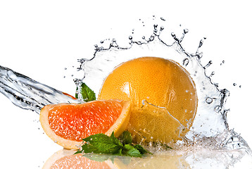 Image showing Water splash on orange with mint isolated on white