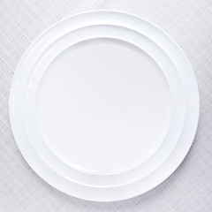 Image showing Empty white plate on tablecloth