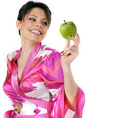 Image showing young beautiful happy woman holding green apple on white