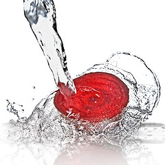 Image showing red beet with water splash isolated on white